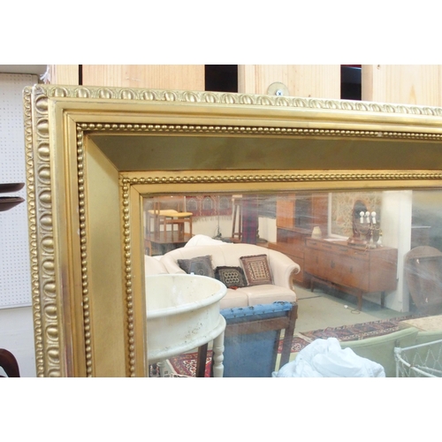 81 - A 20th century gilt framed wall mirror and another smaller gilt framed bevelled glass wall mirror (2... 