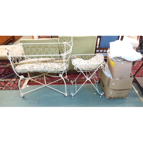 90 - A 19th century wrought iron crib, another smaller crib, baby bath and assorted linens