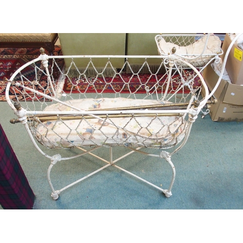 90 - A 19th century wrought iron crib, another smaller crib, baby bath and assorted linens