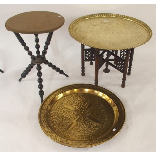 97 - A 20th century Moorish style brass topped folding table, An ebonised circular topped table with turn... 