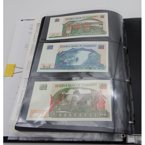 377 - A lot comprising Zimbabwe bank notes featuring a Fifty Trillion Dollars example