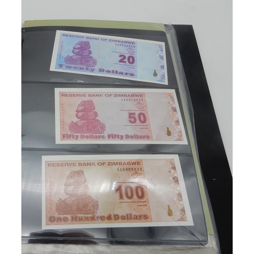 377 - A lot comprising Zimbabwe bank notes featuring a Fifty Trillion Dollars example