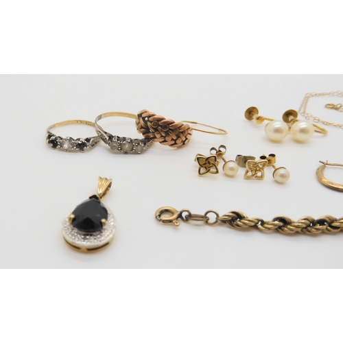 505 - A collection of 9ct gold and yellow metal items to include ring shanks, pendants and chains, weight ... 