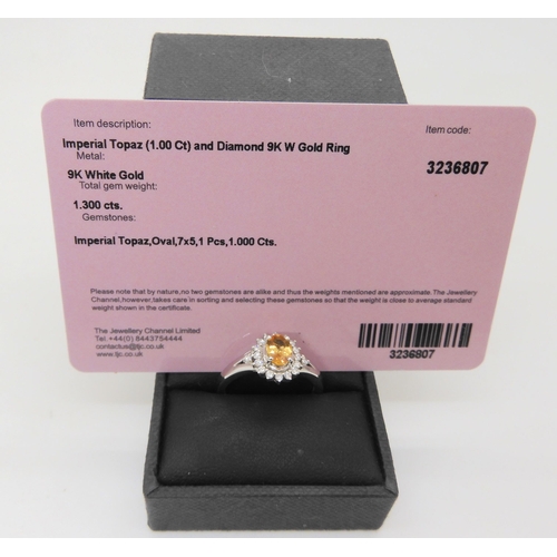 538 - A 9ct white gold imperial topaz and diamond ring, size R, with a Jewellery Channel Guarantee card, w... 