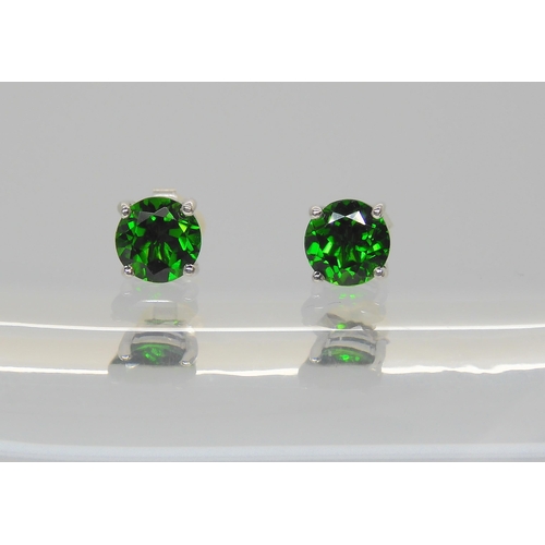 575 - A pair of 9ct white gold Russian diopside stud earrings, weight 1.3gms