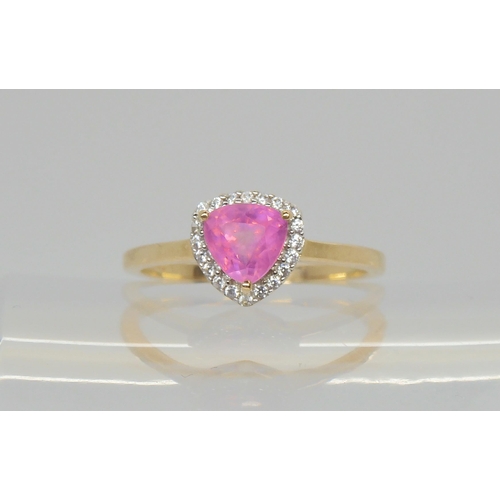 576 - A 9ct gold trilliant cut pink sapphire and white zircon ring, size Q, weight 2.6gms