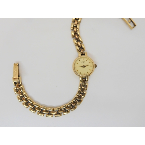 584 - A 9ct gold ladies Rotary watch, weight including mechanism 13.5gms