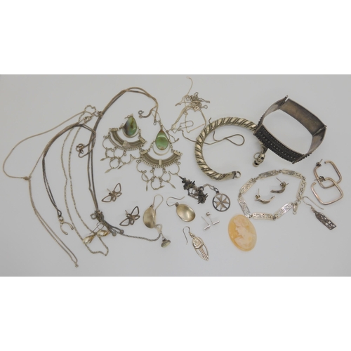 603 - A collection of silver and costume jewellery to include two tribal bangles, Macintosh style items et... 