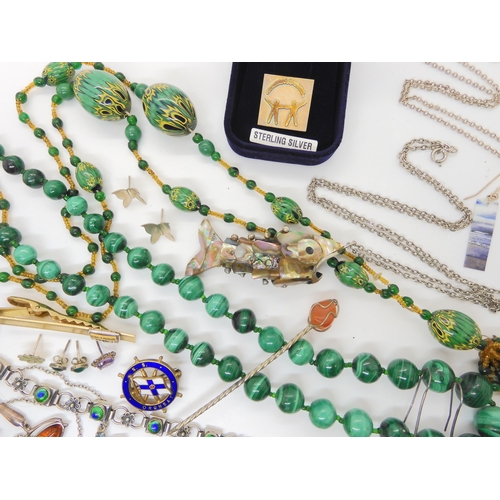 620 - A collection of costume jewellery and silver to include a continental silver and enamel bracelet, a ... 