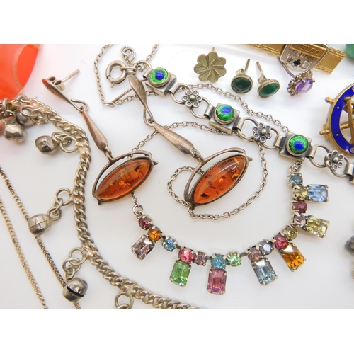 620 - A collection of costume jewellery and silver to include a continental silver and enamel bracelet, a ... 