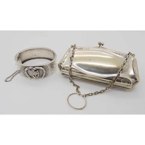 632 - A silver Lucky Fox bangle, hallmarked 1882, together with three white metal and silver charms and an... 