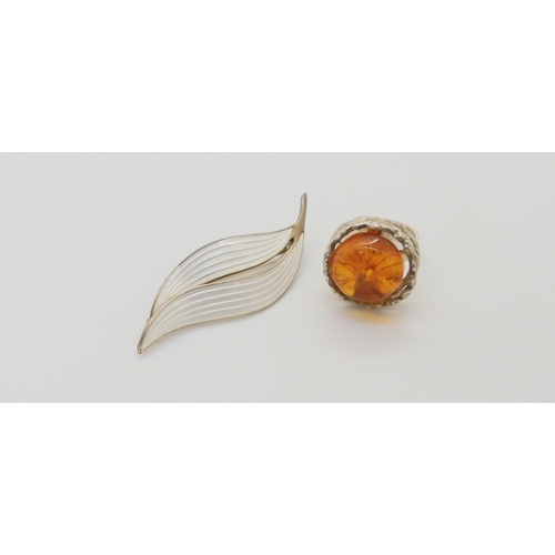 637 - A silver and enamel Aksel Holmsen leaf brooch and a Danish retro silver and amber ring in original b... 