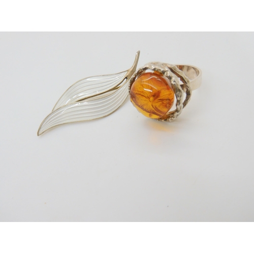 637 - A silver and enamel Aksel Holmsen leaf brooch and a Danish retro silver and amber ring in original b... 