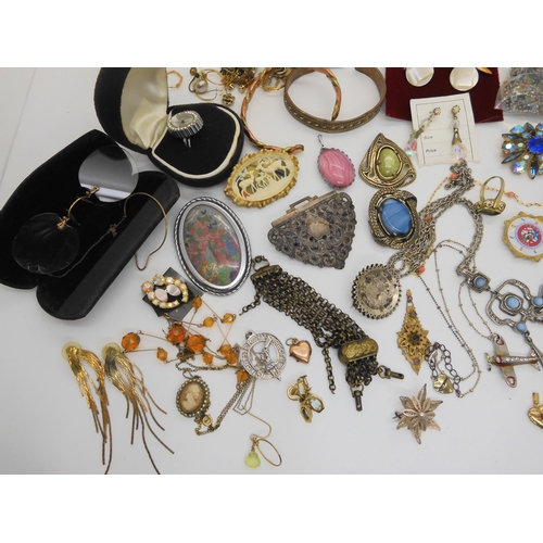 646 - A Swissam ring watch, items by Miracle, vintage glasses and other items