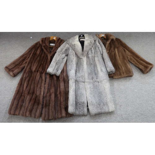 214a - A light grey fur coat a brown fur coat and a jacket