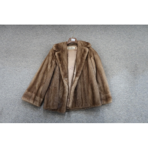 216A - A brown fur jacket and four sheepskin jackets