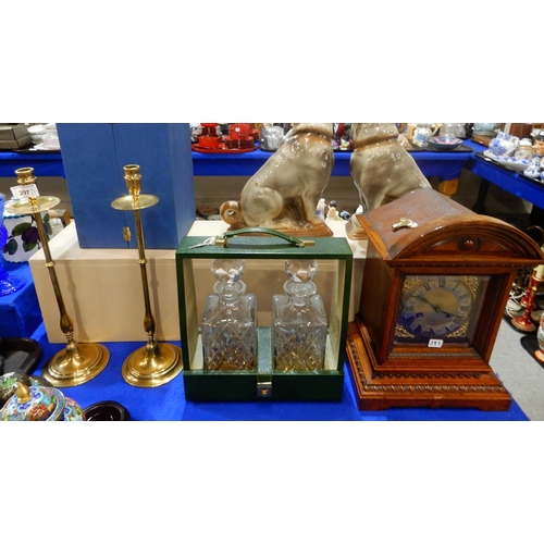 297 - A pair of brass candlesticks, a two bottle leather tantalus and a Jungens mantle clock