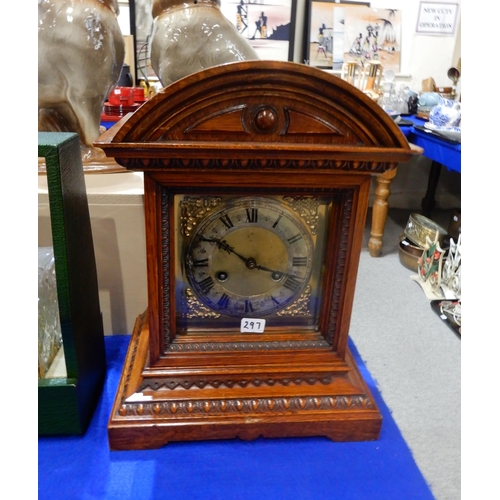 297 - A pair of brass candlesticks, a two bottle leather tantalus and a Jungens mantle clock