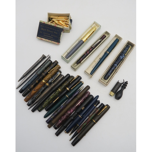 396 - A large collection of pens and propelling pencils, including a number of 14k-nibbed examples, a hall... 