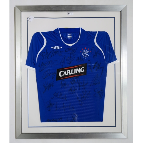 444D - SPORTING MEMORABILIAA framed Glasgow Rangers 2008-09 home football shirt, with team signatures... 