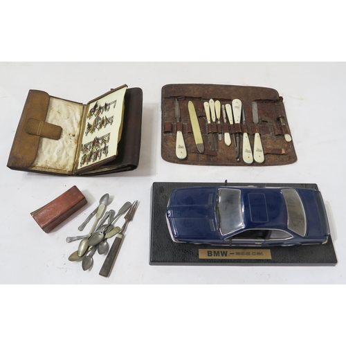 453 - A mixed lot, comprising a leather-bound book of fishing flies, BWM 635CSi scale model car, set of sm... 