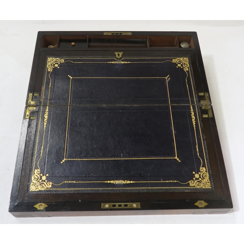 455 - A Victorian brass-bound walnut writing slope, opening to reveal a fitted interior with tooled dark b... 