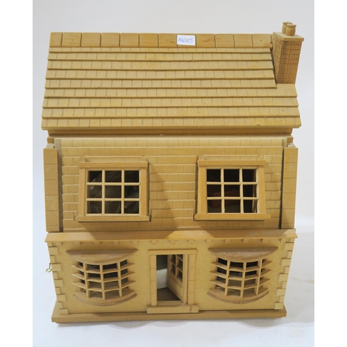 458E - A two-story glass dolls house, approx. 58cm high, containing a quantity of furniture etc., together ... 