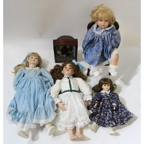 458F - Four various modern bisque-headed dolls, including a 