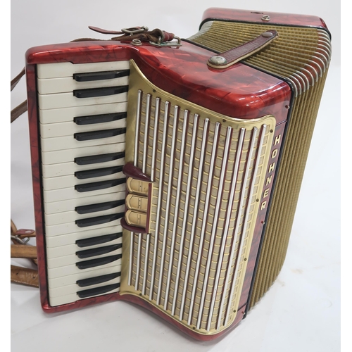 477 - A Hohner 34 key 72 bass piano accordion Arieta IM in red with case