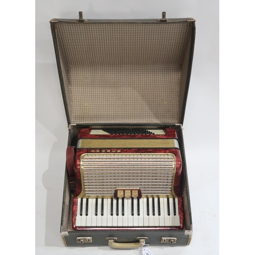 477 - A Hohner 34 key 72 bass piano accordion Arieta IM in red with case