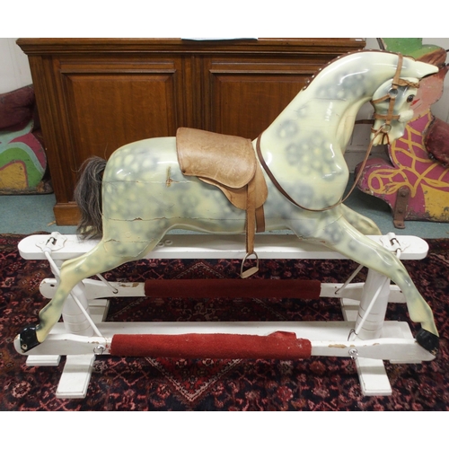 103 - An Edwardian child's rocking with leather reigns and saddle on white painted base, 105cm high x 147c... 