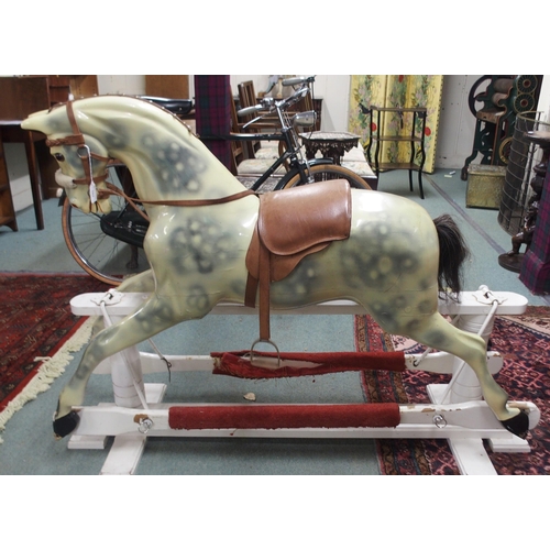 103 - An Edwardian child's rocking with leather reigns and saddle on white painted base, 105cm high x 147c... 