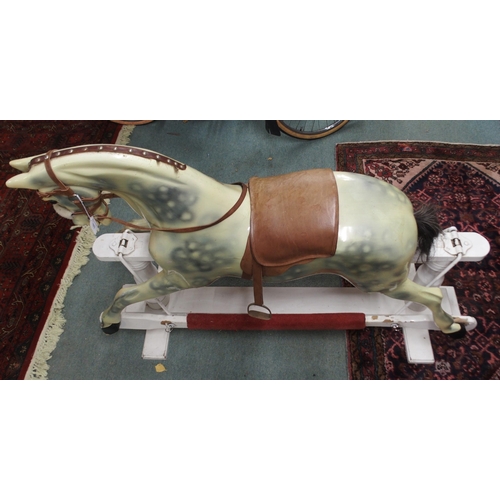 103 - An Edwardian child's rocking with leather reigns and saddle on white painted base, 105cm high x 147c... 