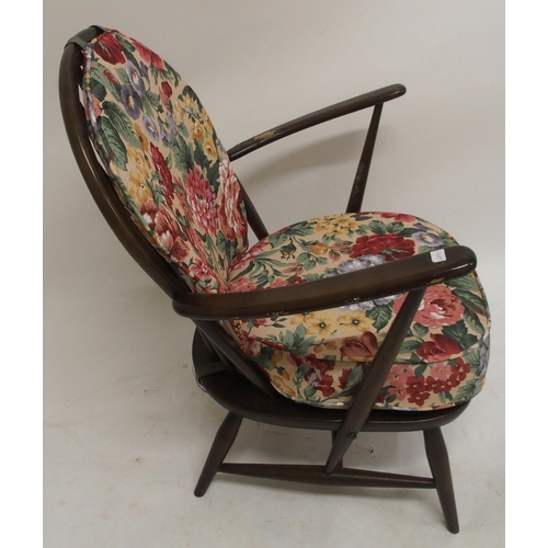 105 - A mid 20th century elm and beech framed Ercol rail back armchair, 80cm high x 71cm wide x 69cm deep