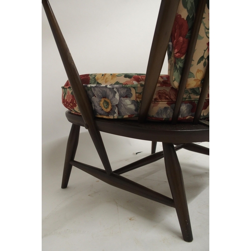 105 - A mid 20th century elm and beech framed Ercol rail back armchair, 80cm high x 71cm wide x 69cm deep