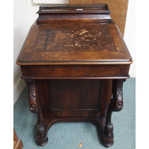 17 - A Victorian walnut Davenport writing desk with gallery topped stationary compartment over writing sl... 