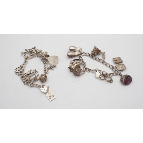 291 - A collection of four silver and white metal charm bracelets, with various silver and white metal cha... 