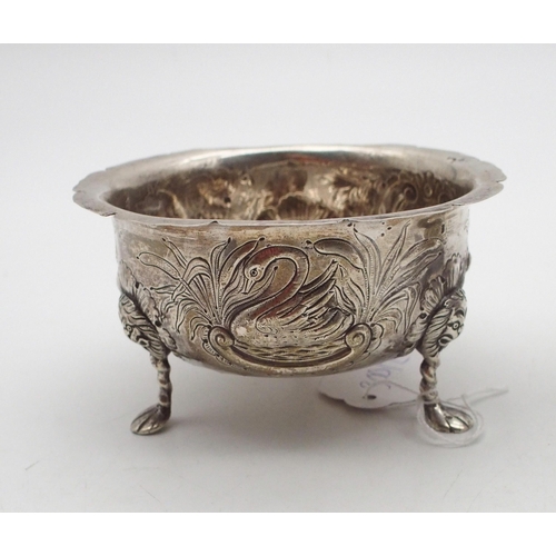 300 - An Irish silver sugar bowl, in the Georgian style, with an everted pie crust rim, the body with repo... 