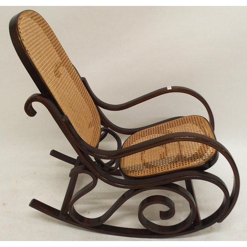 63 - A 20th century bentwood bergere rocking chair, 98cm high x 55cm wide x 96cm deep