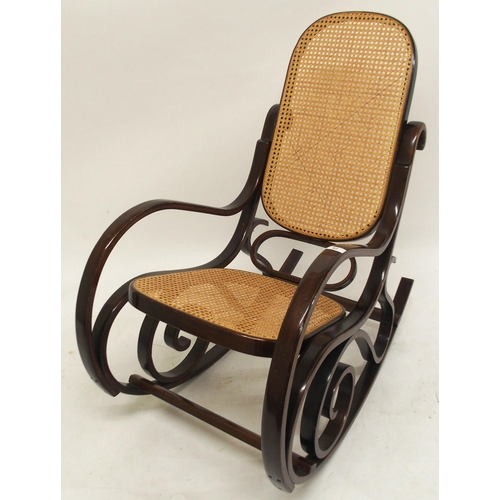 63 - A 20th century bentwood bergere rocking chair, 98cm high x 55cm wide x 96cm deep