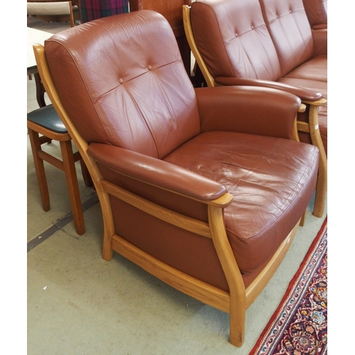 64 - A contemporary Ercol elm and beech framed and chocolate brown leather upholstered three piece suite ... 