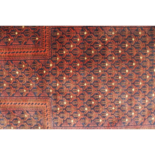 66 - A dark ground eastern prayer rug, 148cm long x 88cm wide