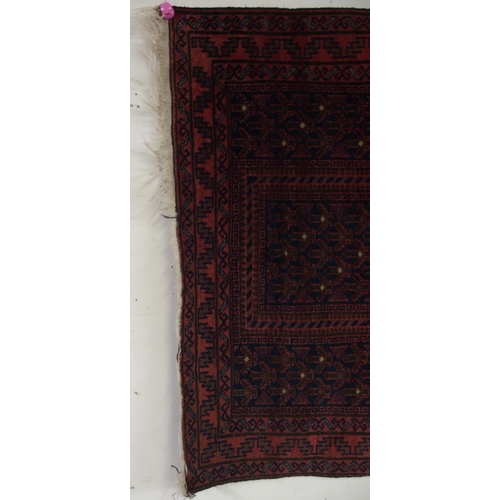 66 - A dark ground eastern prayer rug, 148cm long x 88cm wide