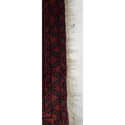 66 - A dark ground eastern prayer rug, 148cm long x 88cm wide