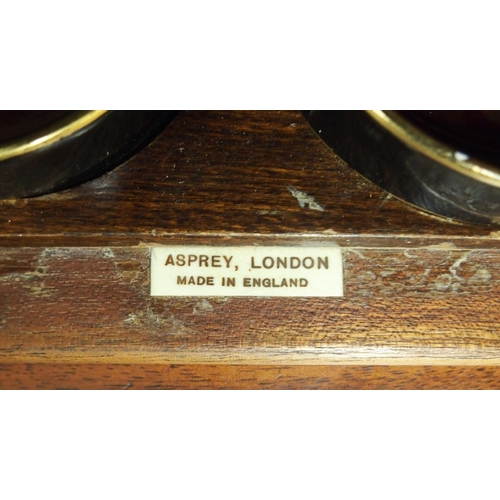 70 - An early 20th century mahogany smokers cabinet with two doors concealing extensively fitting interio... 