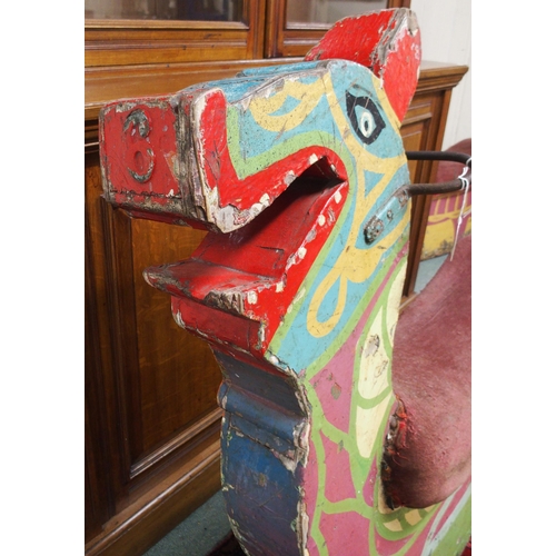 71 - A 20th century fairground merry go round seat painted in the form of a Gaelic dragon, 103cm high x 1... 