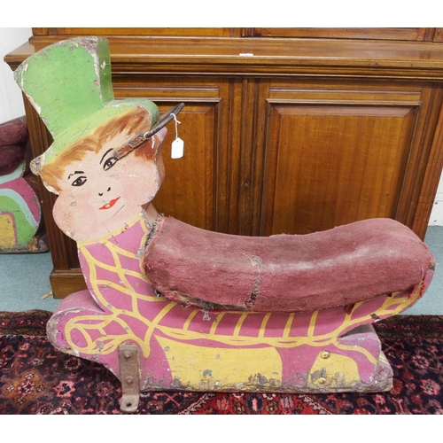 72 - A 20th century fairground merry go round seat painted in the form of a Leprechaun, 99cm high x 104cm... 