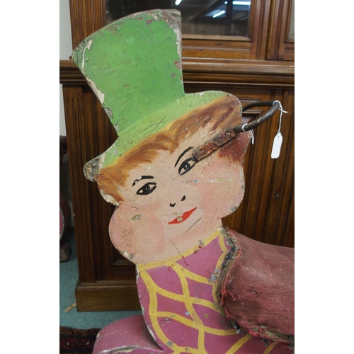 72 - A 20th century fairground merry go round seat painted in the form of a Leprechaun, 99cm high x 104cm... 