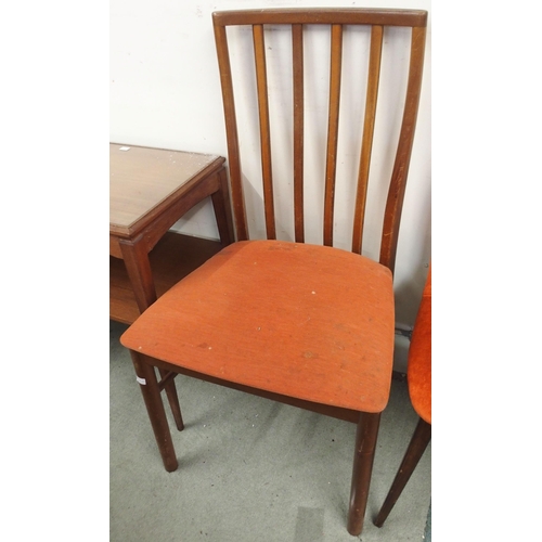 83 - A mid 20th century teak two tier occasional table and a pair of G Plan dining chairs (3)