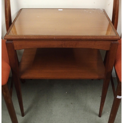 83 - A mid 20th century teak two tier occasional table and a pair of G Plan dining chairs (3)